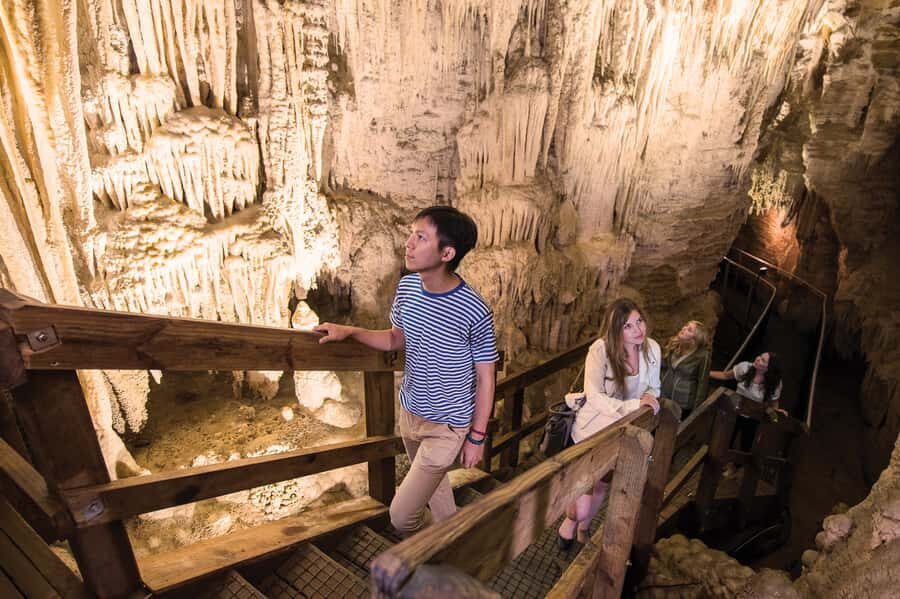 Aranui Cave 1-Hour Guided Tour - Entering the cave: boardwalks, narrow chambers, and high ceilings