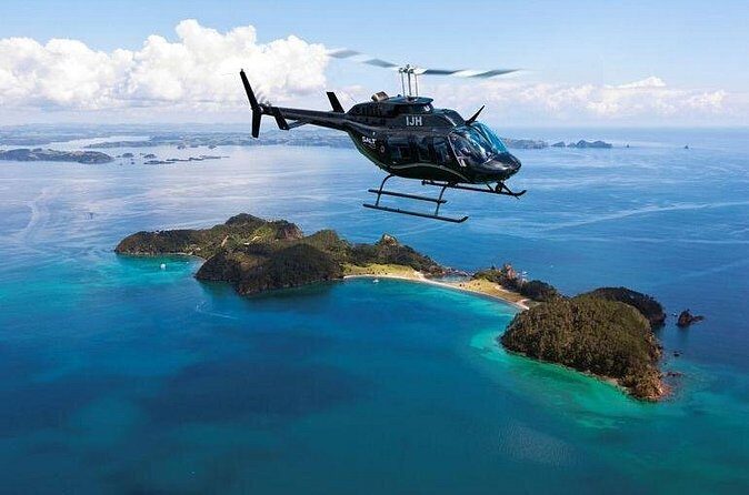 Bay of Islands and Hole in the Rock Scenic Helicopter Tour - The Hole in the Rock hover vs the helipad landing