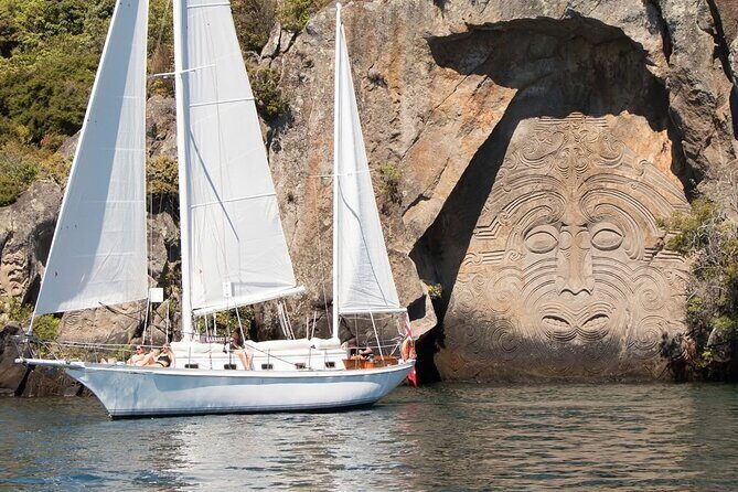 Evening Eco Sailing Adventure to Māori Rock Carvings Lake Taupō - Taupō Bay’s 10-metre artwork: the best way to actually see it