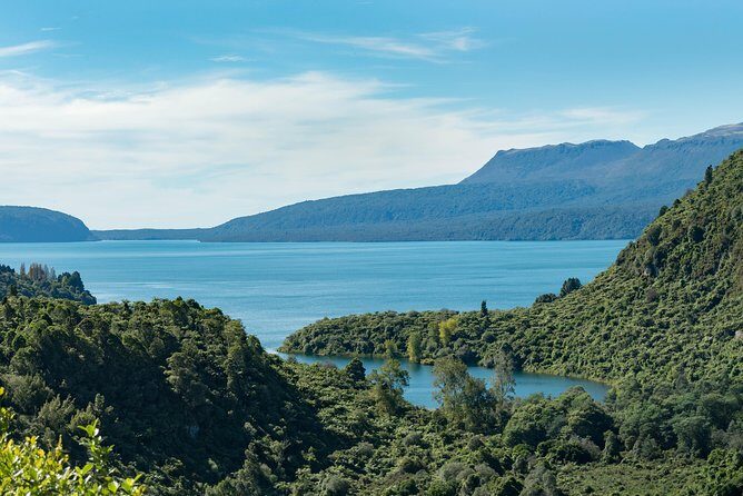 Explore The Lakes Tour - Lake Tarawera shores with Mt Tarawera across the water