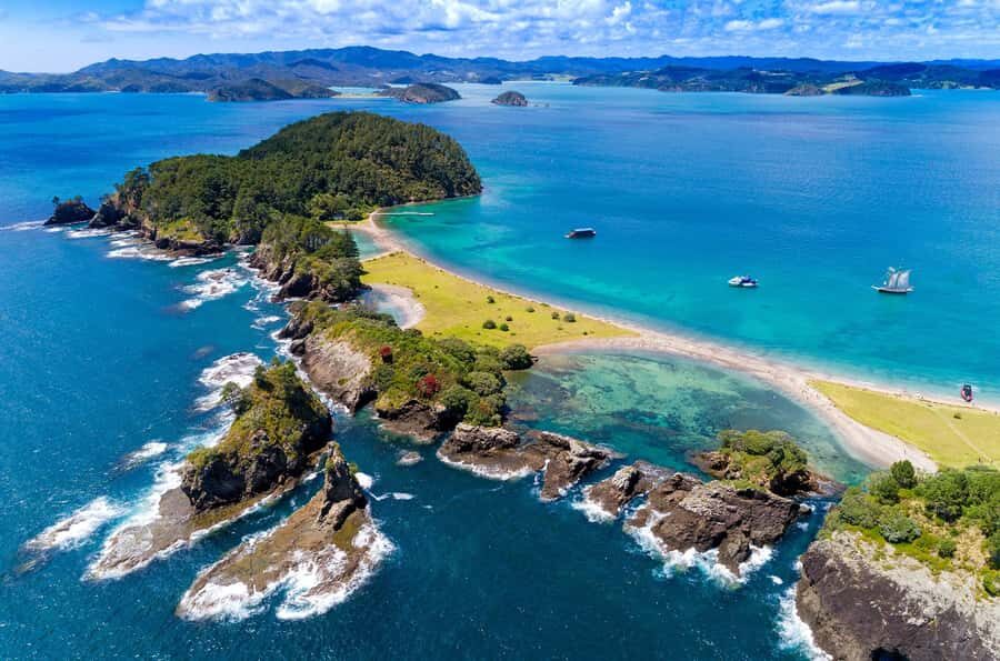 From Paihia: Full-Day Bay of Islands Cruise - Hole in the Rock: the monolith pass and how wind changes everything