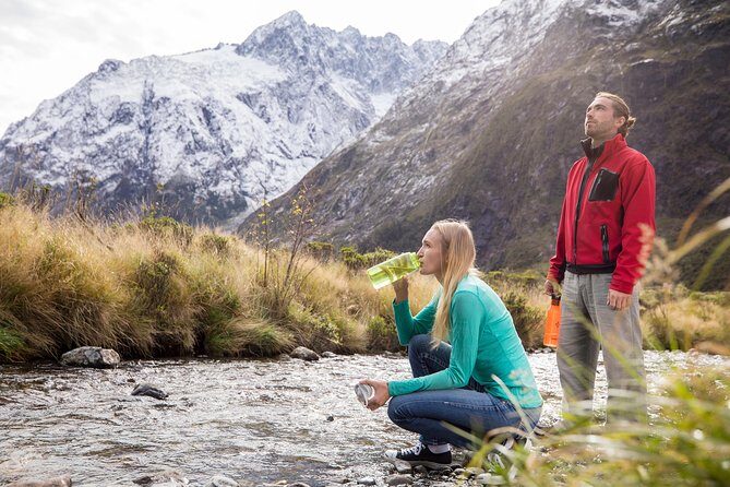 Milford Sound Coach & Cruise ex Te Anau Stunning Views with Lunch - The Milford Sound tunnel and the river drive: tight engineering + wild water