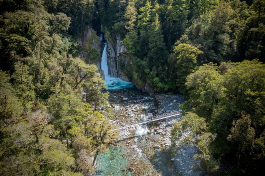 Milford Track: Full Day Guided Hike and Nature Cruise - Giant’s Gate Waterfall and the swing-bridge photo stop