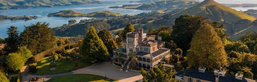 Private Dunedin City Highlights and Otago Peninsula Day Tour - Larnach Castle: Gardens Included, Inside Rooms Are Extra