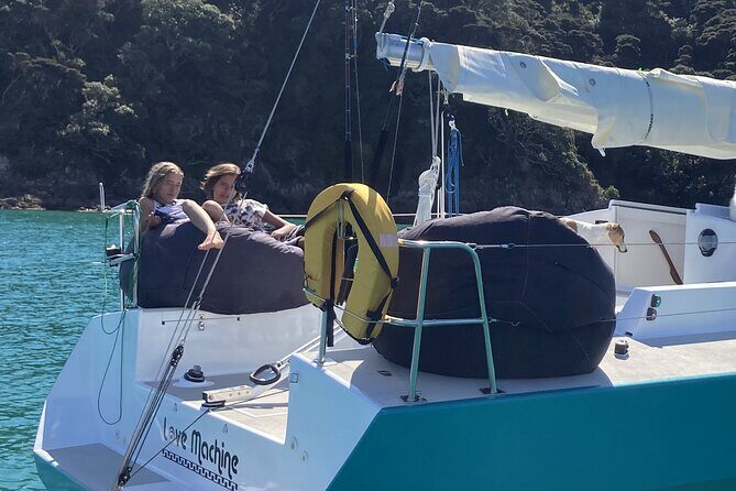 Private Yacht Charter and Island Excursions in the Bay of Islands - Sailing, steering, and the relaxed crew vibe with Erin and Bruno