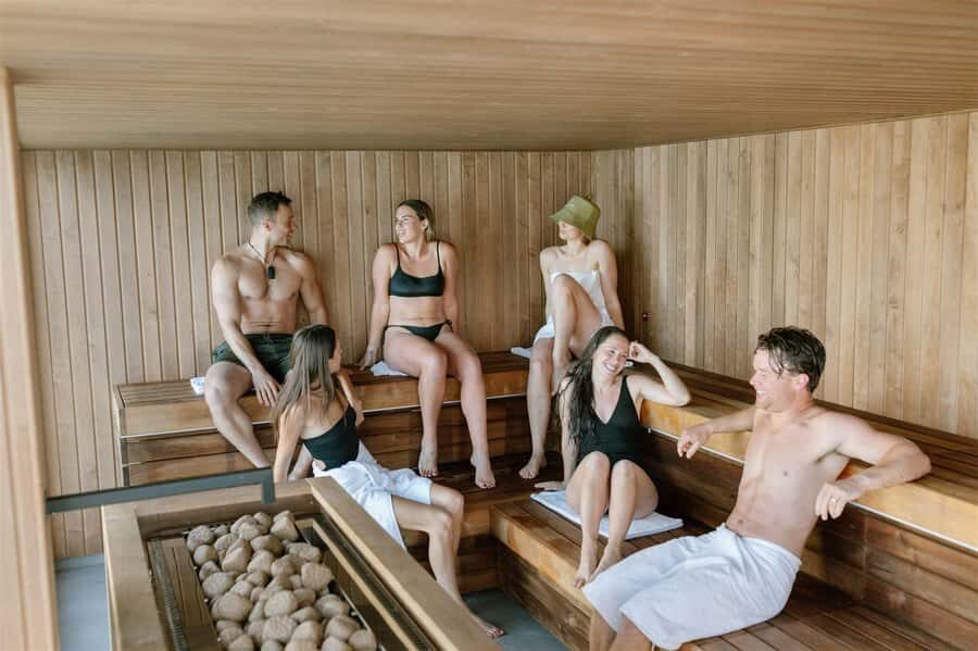 Queenstown: Floating Sauna Experience on Lake Whakatipu - Entering the floating Finnish sauna: heat, calm, and lake air