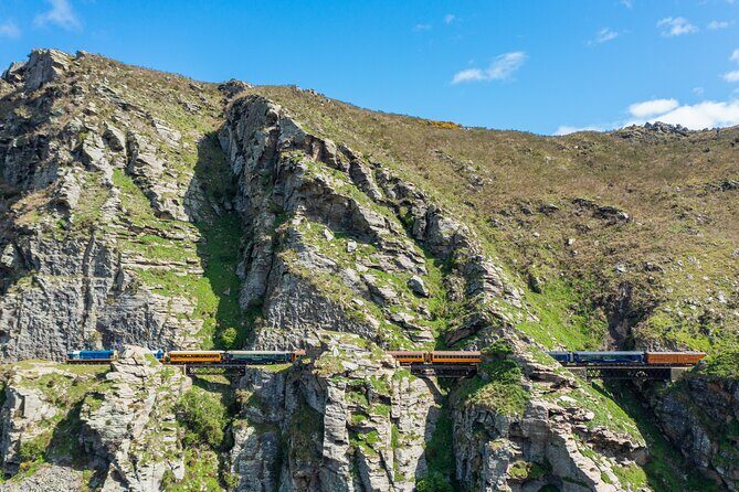 Queenstown to Dunedin with Taieri Gorge Train One-Way Tour - Finishing In Dunedin: Elegant Edwardian Rail Station Drop Point