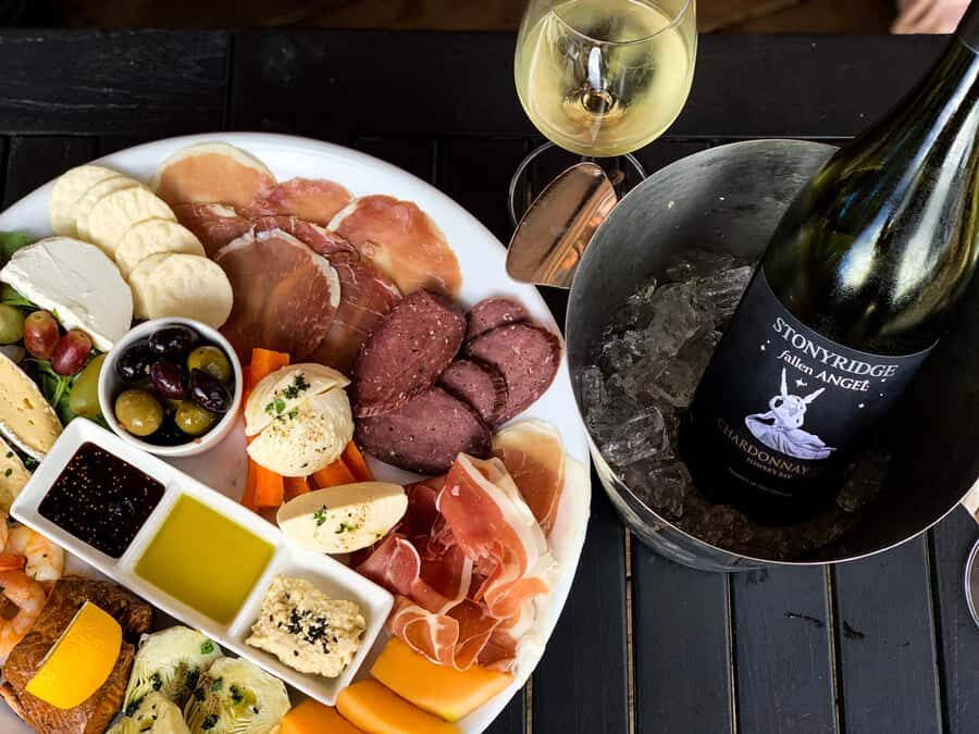 Waiheke: Scenic Taste and Graze Tour with Wine, Whisky, Beer - Mudbrick vineyard: wine tasting with Rangitoto and Hauraki Gulf views