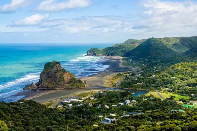 West Coast Discovery Tour - Piha Beach: black iron-sand, Tasman Sea surf, and Lion Rock views