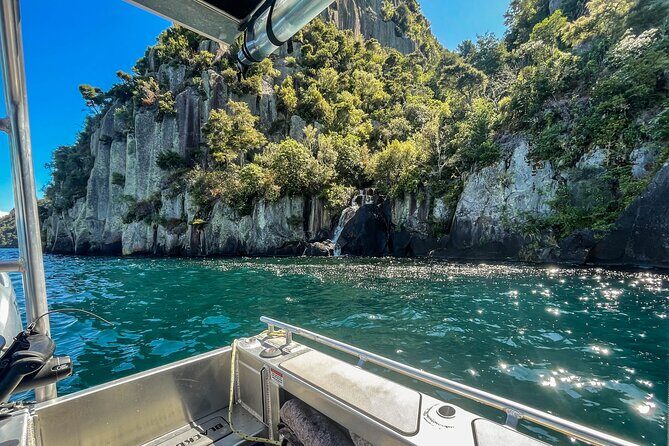 Western Bays Sightseeing Tour from Kinloch Lake Taupo - Stop 1: Western Bay and that water-level view of rock faces